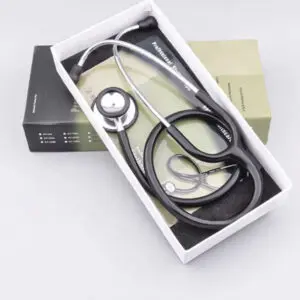 A stethoscope in a white box with a black manual booklet.