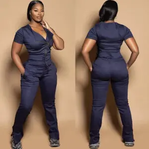 Woman modeling a navy blue medical scrub set from front and back.