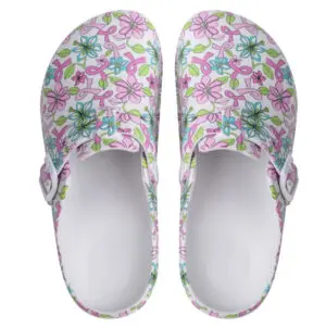 Pair of floral-patterned slip-on clogs with pink and green flowers.