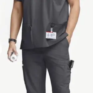 Medical professional wearing gray scrubs with an ID badge and watch.